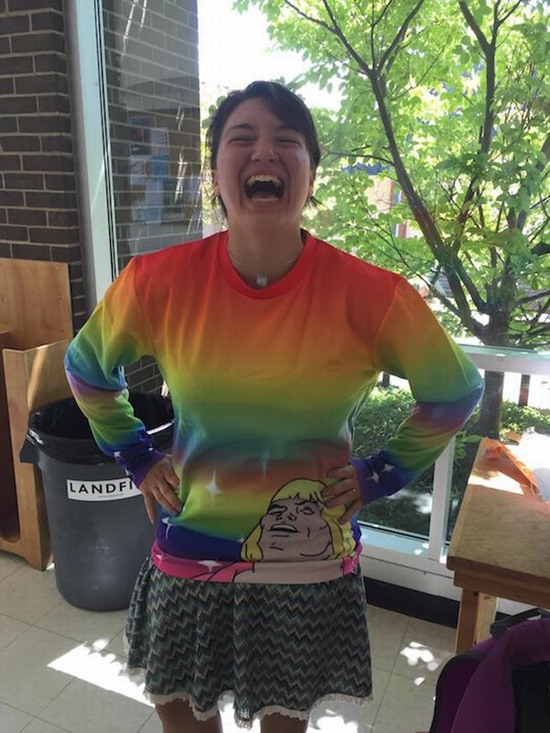 funny picture of girl laughing while wearing rainbow shirt with laughing he-man