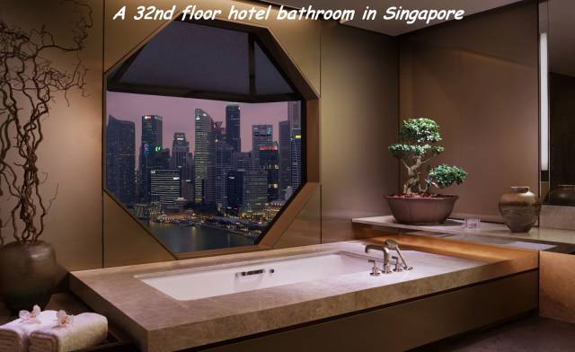 ritz carlton millenia singapore - A 32nd floor hotel bathroom in Singapore