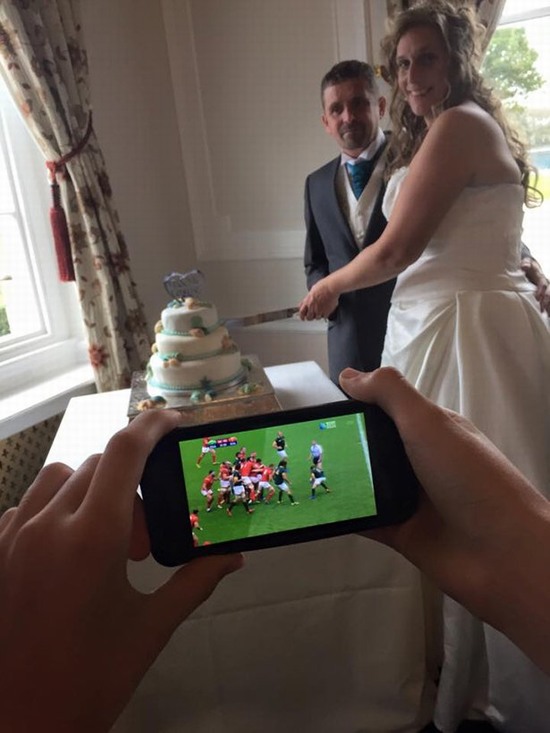 funny pictures - watching football at a wedding