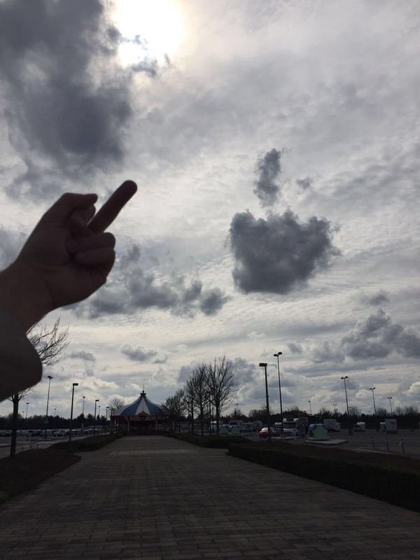 funny picture of cloud flipping the bird and person giving it the middle finger back