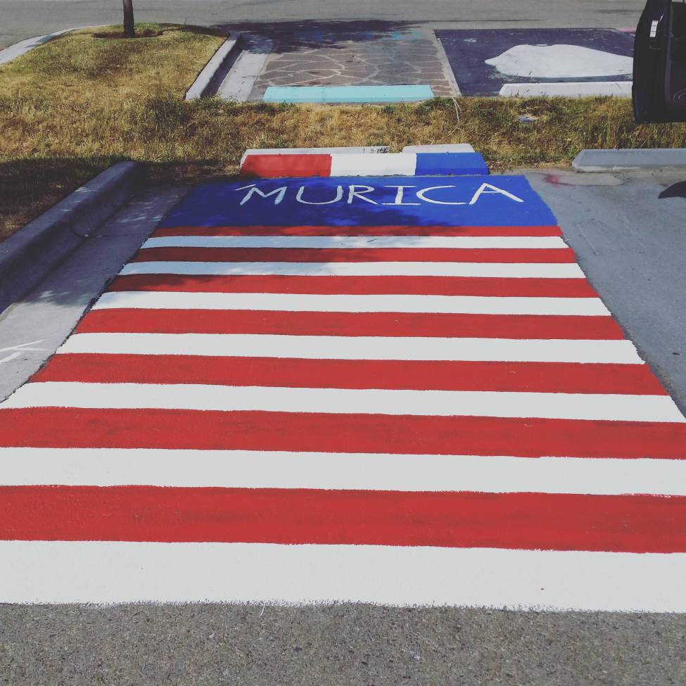 Parking spot painted in american flag colors and marked Murica