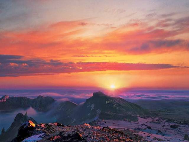 This is "Mt Paekdu's Sunrise." Paekdu is an active volcano that borders North Korea and China.