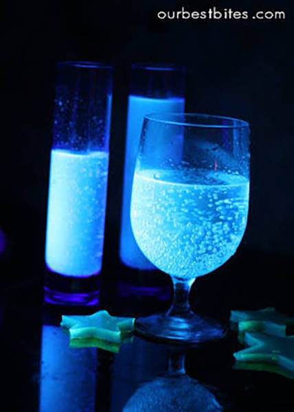 The secret to glowing food is tonic water (diet tonic water works too).  It contains quinine, and guess what happens when you expose quinine to black light?