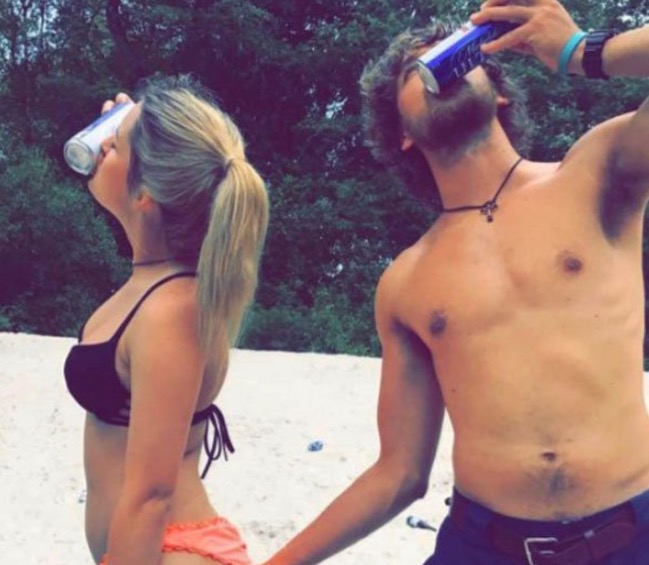 couple drinking beer in bathing suits
