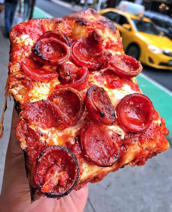 Pizza slice with plenty of tomatoes