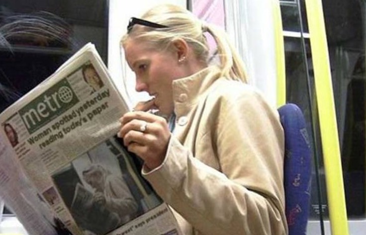 woman reading a newspaper with a cover story of her reading the paper.