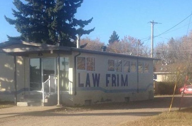 Sign on the side of a trailer that says Law Frim