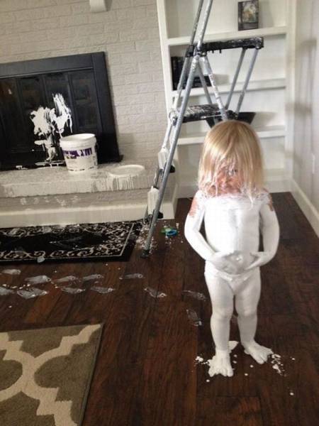 child covered in white paint