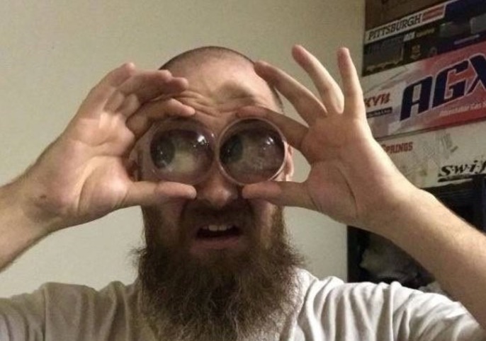 Man with funky lenses that make his eyes look big.