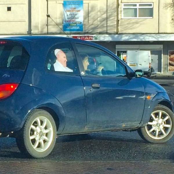 pope sticker in a car