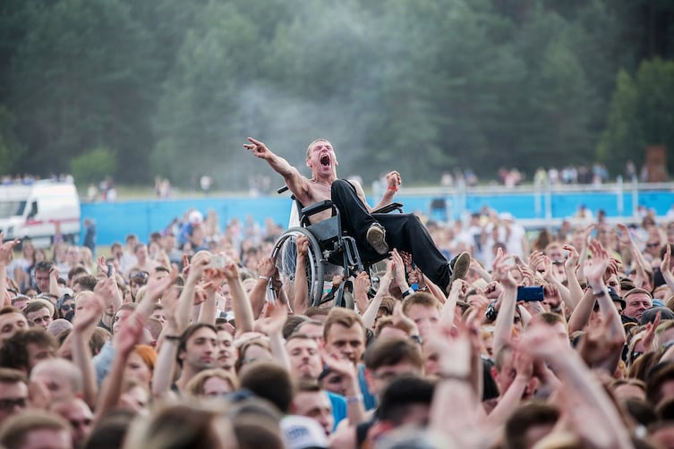 This man lifted by the crowd was quoted saying, "I could have flown"

Taking place at a Dai Dorogu concert in Russia, the crowd helped wheelchair-bound Konovalchik get to the front. Even better? The band means "Clear the Road" in English.