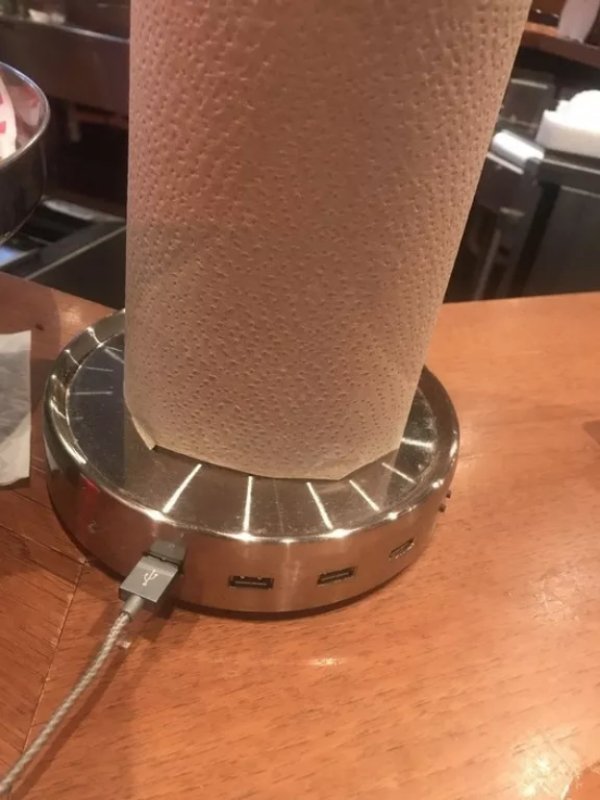 This bar’s paper towel holder has a USB charger.