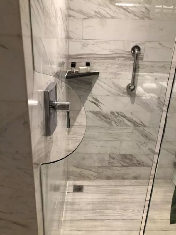 OR if you prefer this hotel’s shower door specifically designed for the same purpose to protect you from getting wet while you set the water temperature.