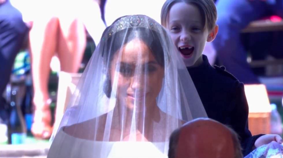 The expression on the face of the page boy responsible for holding Meghan's train