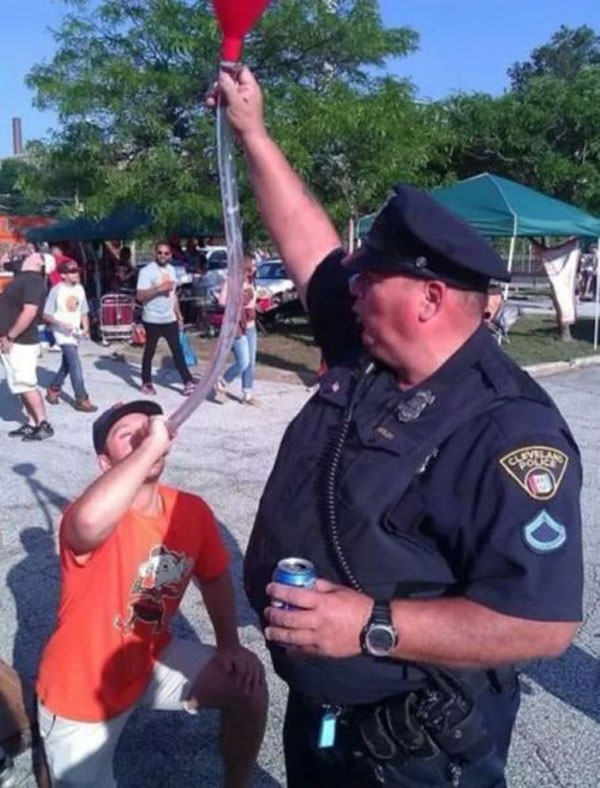 cop holding beer bong