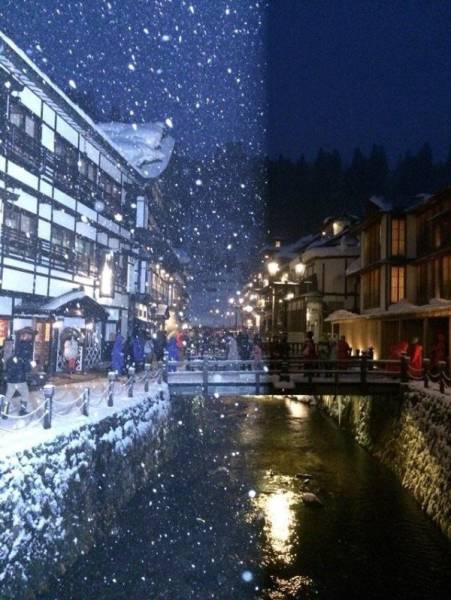 “Caught someone else’s camera flash when taking this photo of snow falling at Ginzan Onsen.”