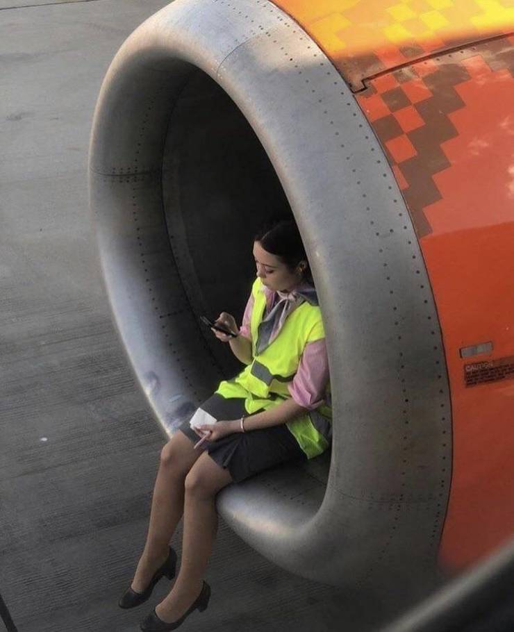 woman sitting in jet engine