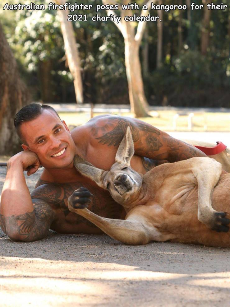 Firefighter - Australian firefighter poses with a kangoroo for their 2021 charity calendar.
