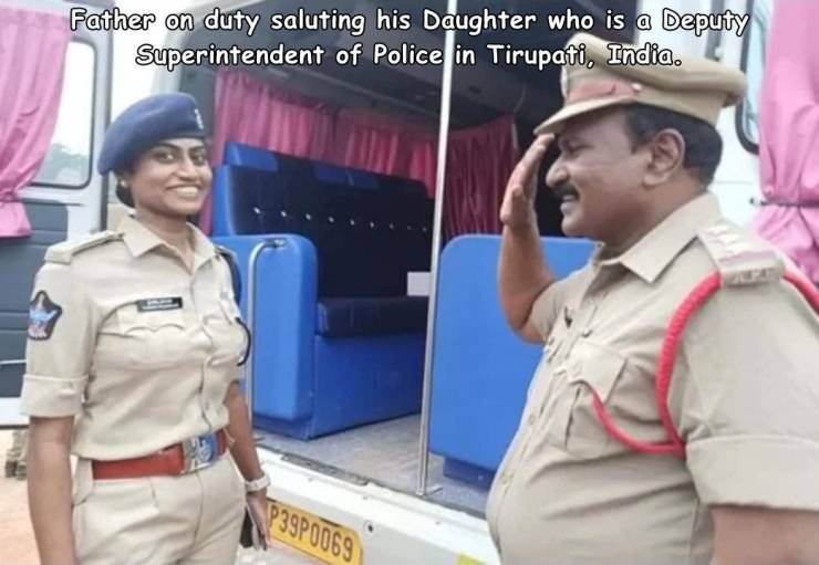 Inspector - Father on duty saluting his Daughter who is a Deputy Superintendent of Police in Tirupati, India. P39P0069