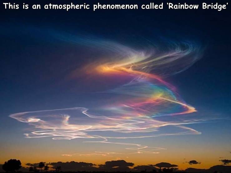 cloud iridescence - This is an atmospheric phenomenon called 'Rainbow Bridge
