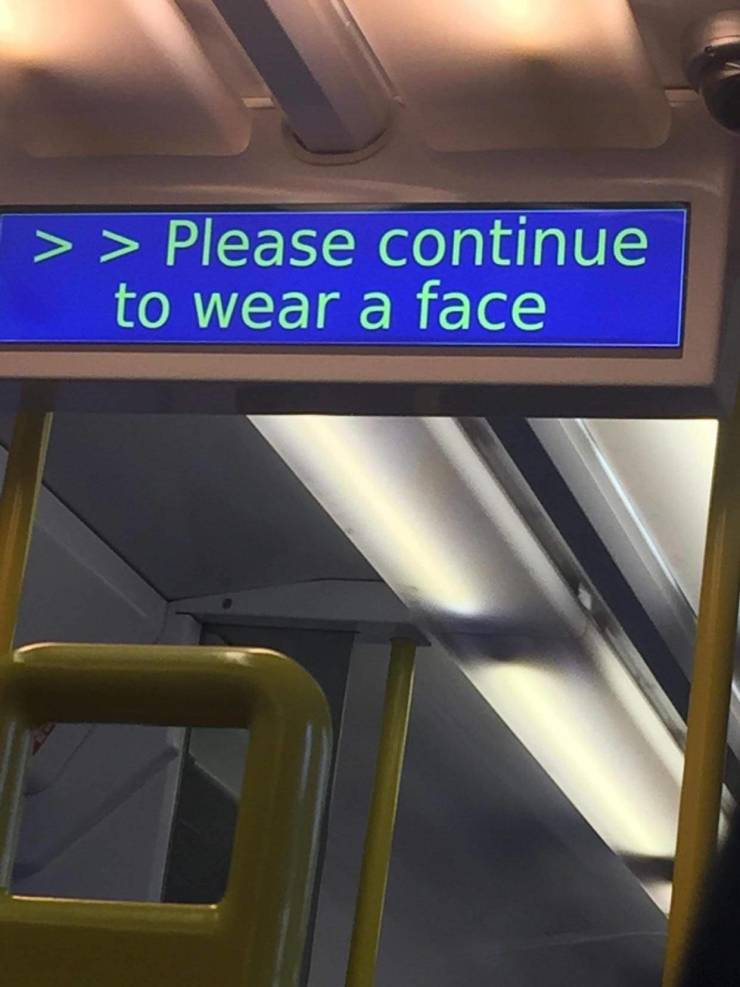 signage - > > Please continue to wear a face