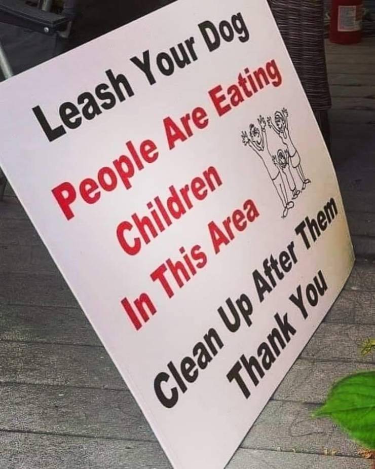 sign - Leash Your Dog People Are Eating Children 1986 In This Area Thank You Clean Up After Them
