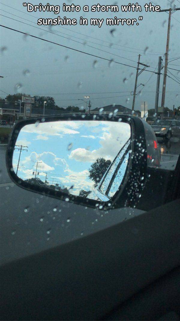 reflection - "Driving into a storm with the sunshine in my mirror."