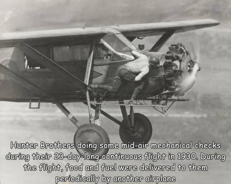 fun randoms - aviation - Hunter Brothers doing some midair mechanical checks during their 23daylong continuous flight in 1930. During the flight, food and fuel were delivered to them periodically by another airplane