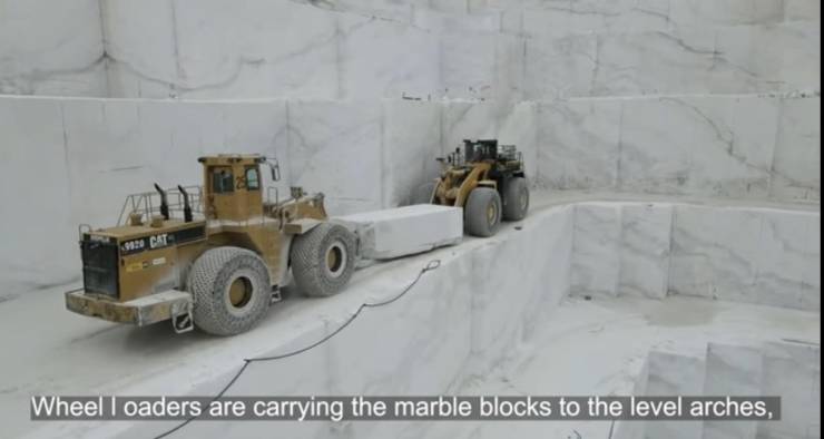 fun randoms - snow - 2920 Cat Wheel loaders are carrying the marble blocks to the level arches,