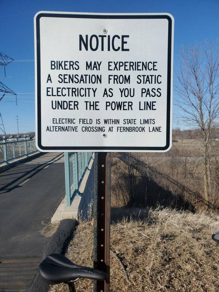 fun randoms - signs - Notice Bikers May Experience A Sensation From Static Electricity As You Pass Under The Power Line Electric Field Is Within State Limits Alternative Crossing At Fernbrook Lane