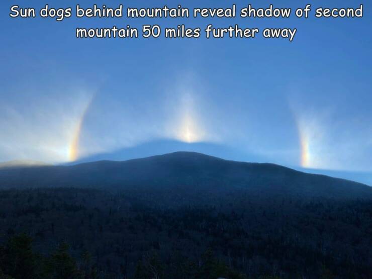 fun randoms - nature - Sun dogs behind mountain reveal shadow of second mountain 50 miles further away