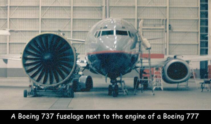 fun randoms - funny photos - 777 engine 737 fuselage - A Boeing 737 fuselage next to the engine of a Boeing 777