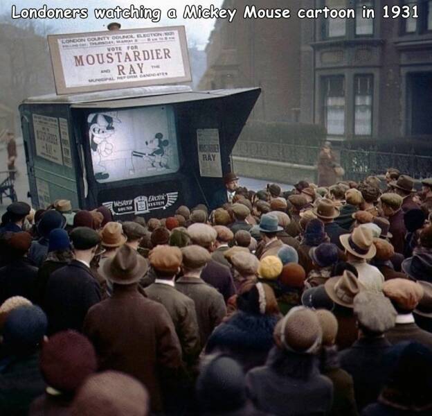 monday morning randomness - audience watching mickey mouse - Londoners watching a Mickey Mouse cartoon in 1931 London County Counol Election Thursday, Man 100 Vote For Moustardier Ray Unicipal Reform Gandes Westora c Sound Sin Bore 2000 Ray