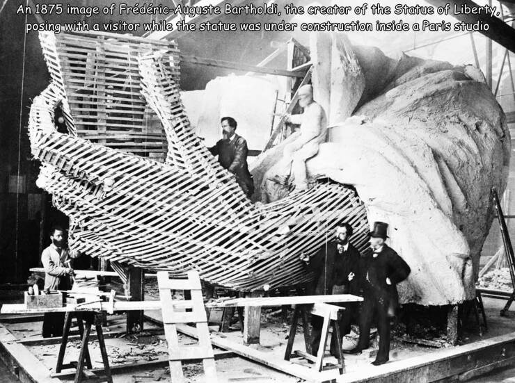 cool pics and photos - construction of the statue of liberty - An 1875 image of FrdricAuguste Bartholdi, the creator of the Statue of Liberty, posing with a visitor while the statue was under construction inside a Paris studio Har