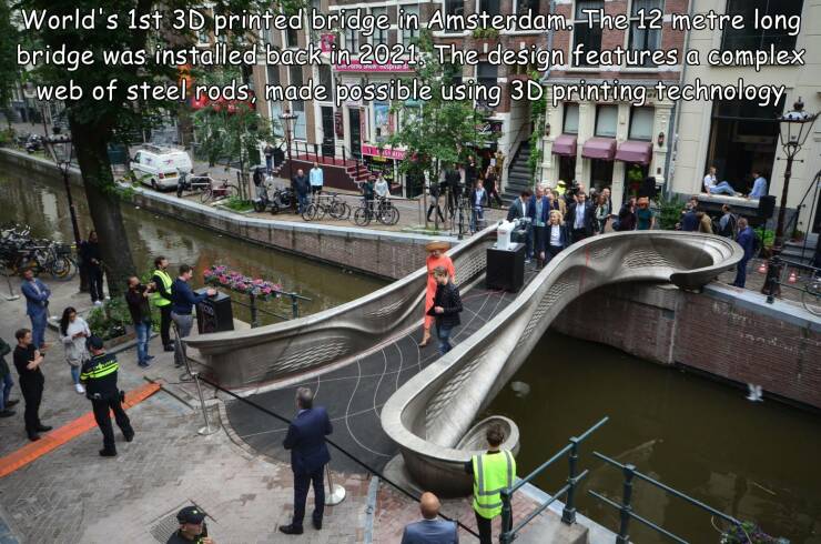 world's first 3d printed steel bridge - World's 1st 3D printed bridge in Amsterdam. The 12 metre long bridge was installed back in 2021, The design features a complex web of steel rods, made possible using 3D printing technology
