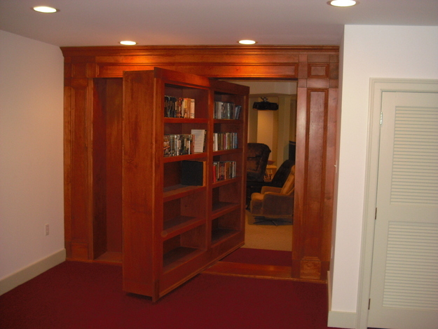 A bookshelf that rotates to reveal a hidden den.