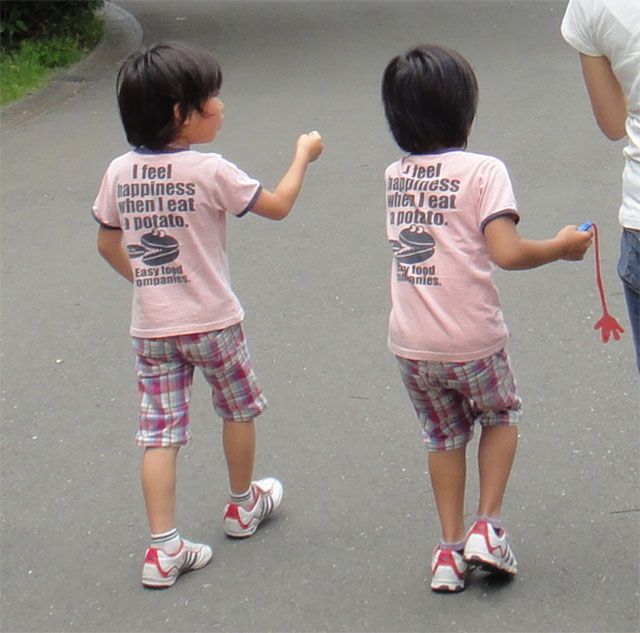 Asians Wearing Shirts With American Writing