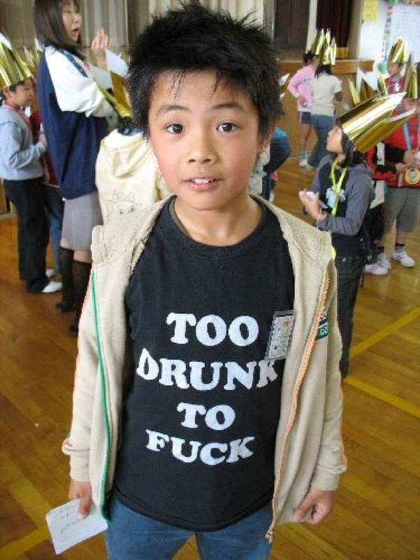 Asians Wearing Shirts With American Writing