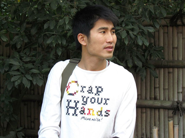 Asians Wearing Shirts With American Writing