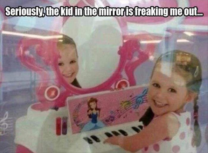 think her mirror is broken - Seriously, the kid in the mirror is freaking me out.