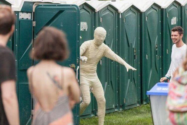 people in porta potty