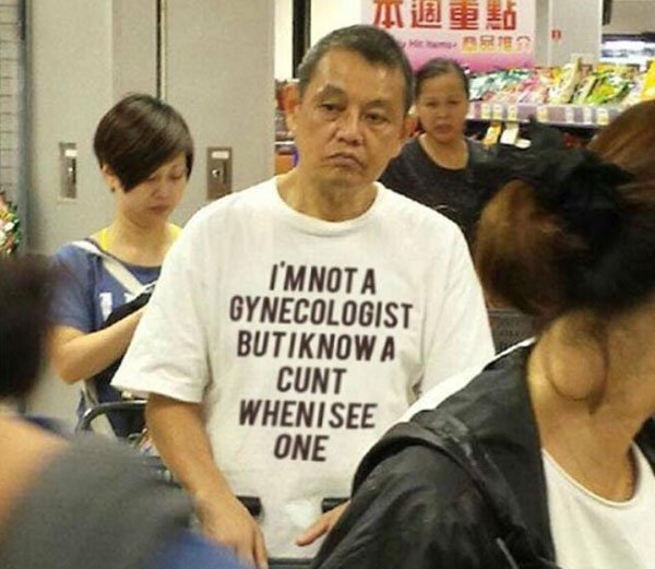 Man who looks really fed up with funny shirt.