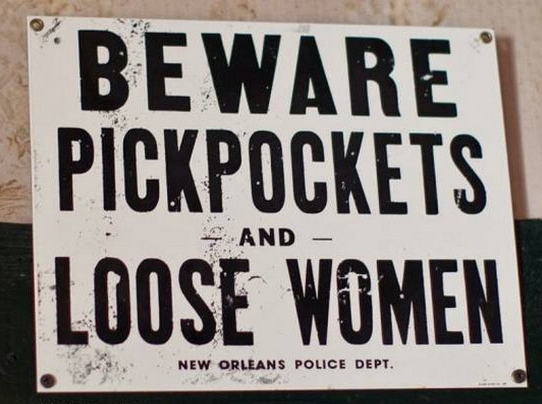 street sign - Beware Pickpockets Loose Women And New Orleans Police Dept.