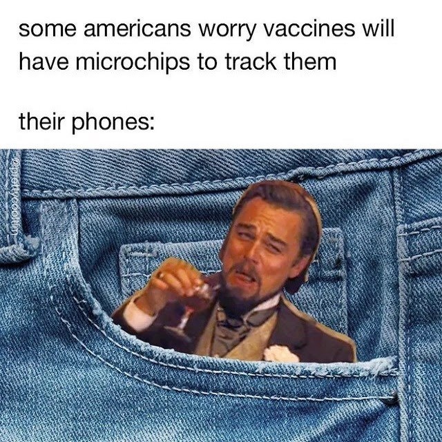 photo caption - some americans worry vaccines will have microchips to track them their phones