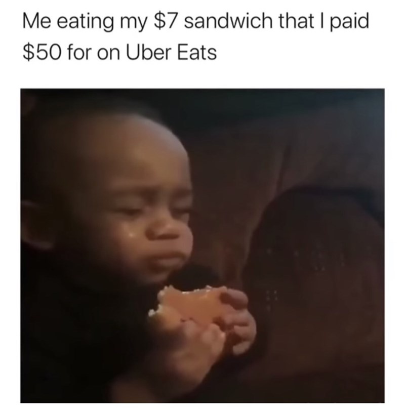 photo caption - Me eating my $7 sandwich that I paid $50 for on Uber Eats