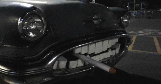 old car with teeth and cigarette