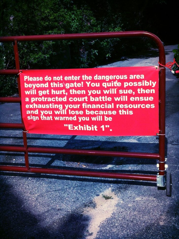 hilarious signs only found in texas - Please do not enter the dangerous area beyond this gate! You quite possibly will get hurt, then you will sue, then a protracted court battle will ensue exhausting your financial resources and you will lose because thi