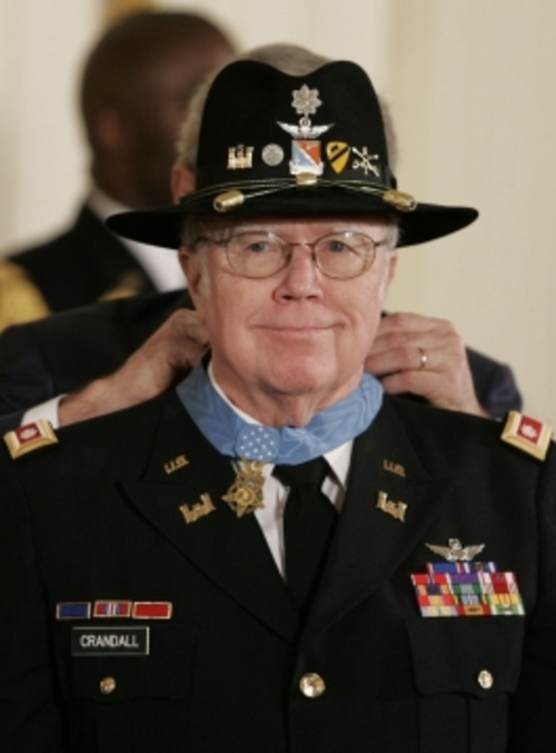 In 2007, Bruce Candall received the Medal of Honor for laughing in the face of danger and providing critical air support during Vietnam's Battle of Ia Drang.While medical evacuation was not his mission, he immediately sought volunteers and with complete disregard for his own personal safety, led the two aircraft to Landing Zone X-Ray. Despite the fact that the landing zone was still under relentless enemy fire, Major Crandall landed and proceeded to supervise the loading of seriously wounded soldiers aboard his aircraft.