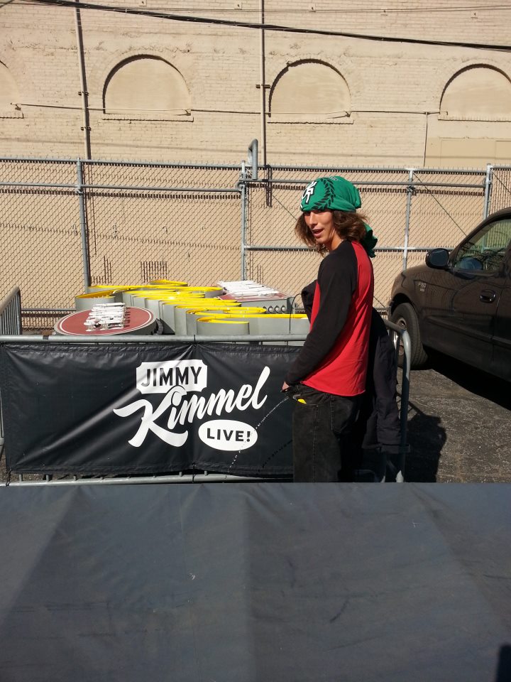 Kai the homeless hatchet wielding hitch-hiker pisses on Jimmy Kimmel's banner.