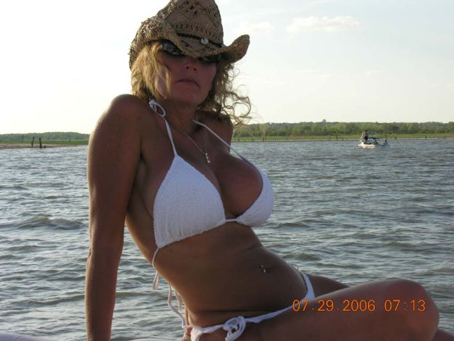 Cowgirl with big fake boobs